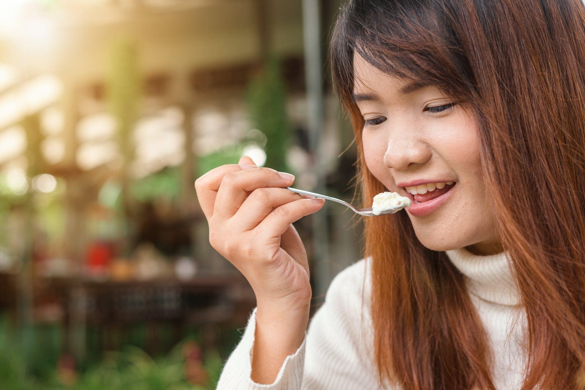 Girl eating yogurt